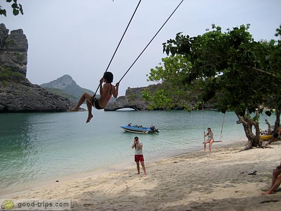 Girl on swing on Ko Sam Sao beach