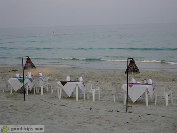 Tables of Seascape Beach Resort restaurant in the evening